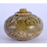 AN EARLY 20TH CENTURY MIDDLE EASTERN SOAPSTONE BOX AND COVER of naturalistic form. 5 cm wide.