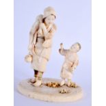 A 19TH CENTURY JAPANESE MEIJI PERIOD CARVED IVORY OKIMONO modelled as a female and child. 13 cm x 9