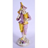 A 19TH CENTURY GERMAN PORCELAIN FIGURE OF A STANDING DANDY modelled holding an item in hand. 22.5 cm