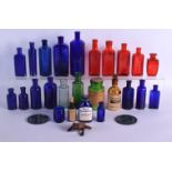 A COLLECTION OF VINTAGE GLASS POISON BOTTLES in various forms and sizes. (qty)