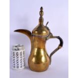 AN EARLY 20TH CENTURY OMANI MIDDLE EASTERN BRASS EWER. 30 cm x 18 cm.