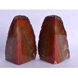 A PAIR OF SOUTH AMERICAN BRAZILIAN AGATE BOOK ENDS of naturalistic form. Each 17 cm x 7 cm.