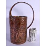 AN ARTS AND CRAFTS COPPER JUG decorated in foliage. 34 cm x 18 cm.