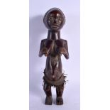 AN AFRICAN TRIBAL LUBA FEMALE FIGURE modelled clutching her breasts. 27 cm high.