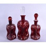 THREE BOHEMIAN GLASS VASES AND COVERS. Largest 27 cm high. (3)