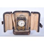 A CHARMING MINIATURE SILVER AND ENAMEL CARRIAGE CLOCK IN ORIGINAL LEATHER CASE. Stamped 925, 5.2cm