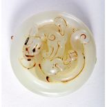 A CHINESE JADE ROUNDELL CARVED WITH A DRAGON. 5cm diameter, weight 41.5g