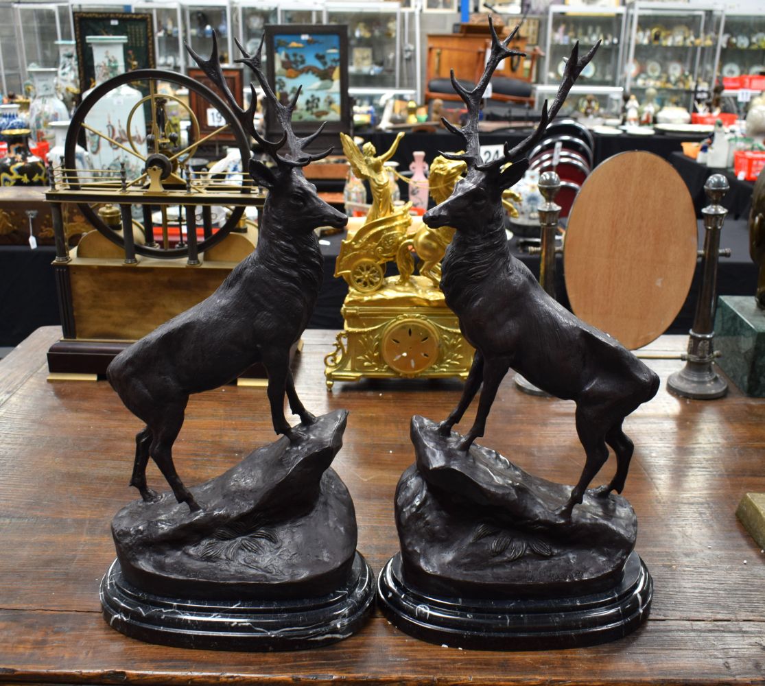 A LARGE PAIR OF CONTEMPORARY BRONZE STAGS. 70 cm x 30 cm.