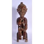 AN AFRICAN TRIBAL YORUBA SEATED FEMALE FIGURE. 30 cm x 8 cm.