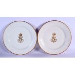 A PAIR OF FRENCH NAPOLEON III SEVRES PORCELAIN PLATES with gilt monogram. 24 cm diameter.