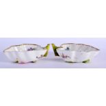 A PAIR OF 19TH CENTURY EUROPEAN PORCELAIN LEAF SHAPED DISHES painted with flowers. 10 cm x 6 cm.