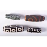 FOUR CHINESE ZHI BEADS. Largest 3.9cm x 1.4cm, total weight 32.g (4)