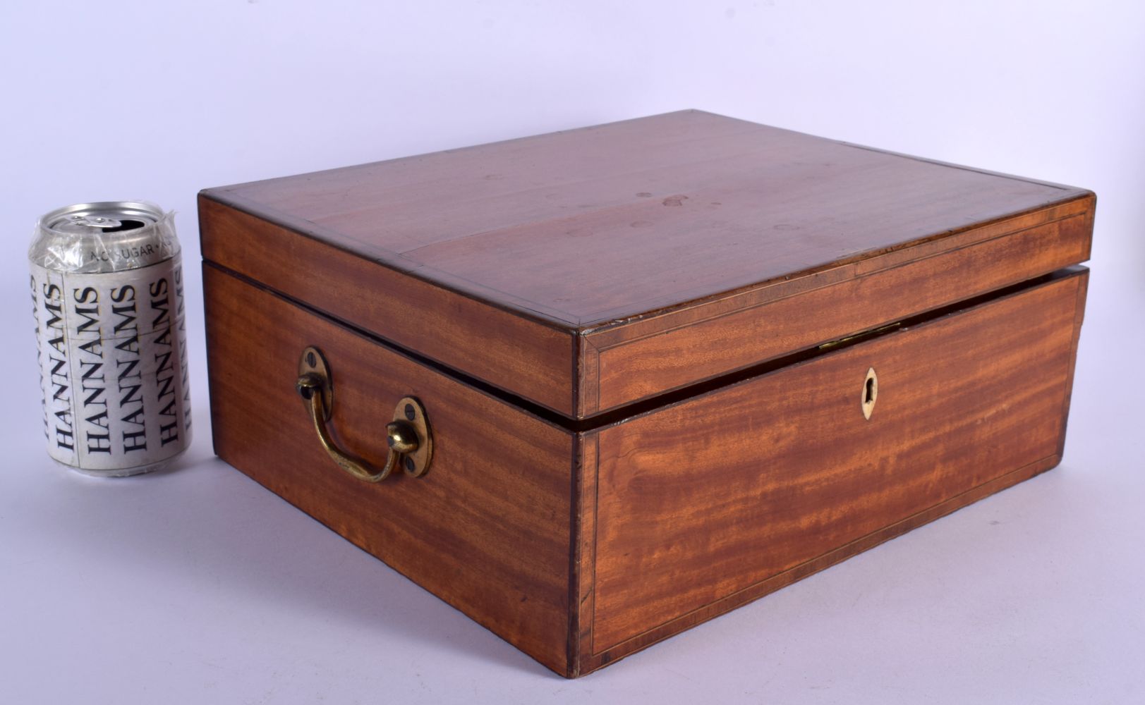 A FINE EARLY VICTORIAN MAHOGANY AND SATINWOOD TRAVELLING VANITY BOX with fitted interior and scent b