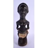 AN AFRICAN TRIBAL BAULE FIGURE with apron and copper necklace. 31 cm high.