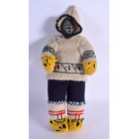 A VERY UNUSUAL EARLY 20TH CENTURY NORTH AMERICAN INUIT STONE HEAD DOLL with original clothing. 27 cm