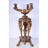 A large gilded wooden candelabra with winged women and beasts heads decoration .59cm.