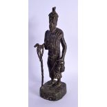 AN 18TH/19TH CENTURY MIDDLE EASTERN BRONZE FIGURE OF A MALE modelled holding a teapot and staff. 24