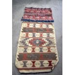 A small Turkish rug together with a fragment of another rug 138 x 100 cm.