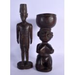 A VINTAGE AFRICAN TRIBAL CARVED WOOD STANDING FIGURE OF A MALE together with another fertility figur
