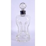AN ANTIQUE SILVER MOUNTED GLASS DECANTER. 19 cm high.