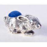 A SILVER PIN CUSHION IN THE FORM OF A RABBIT. Stamped 925, 1.6cm x 3.6cm, weight 15g