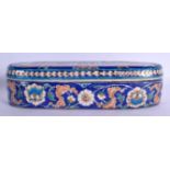 A TURKISH OTTOMAN IZNIK PEN BOX AND COVER painted with flowers. 28 cm x 9 cm.