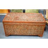A LOVELY 19TH CENTURY BURMESE INDIAN RED LACQURED WOODEN COFFER AND COVER decorated all over with fo