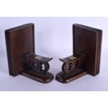 A PAIR OF EARLY 20TH CENTURY TRIBAL AFRICAN BOOK ENDS formed as head rests. Each 16 cm x 12 cm.