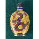 A Chinese Cloisonne enamelled snuff bottle decorated with a dragon. 8.5cm.