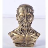 A BRASS VEST CASE IN THE FORM OF AN ANATOMICAL MAN. 5.9cm x 4.7cm, weight 72.1g