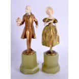 A PAIR OF ART DECO COLD PAINTED BRONZE AND IVORY FIGURES Attributed to Ferdinand Preiss. 15 cm high.