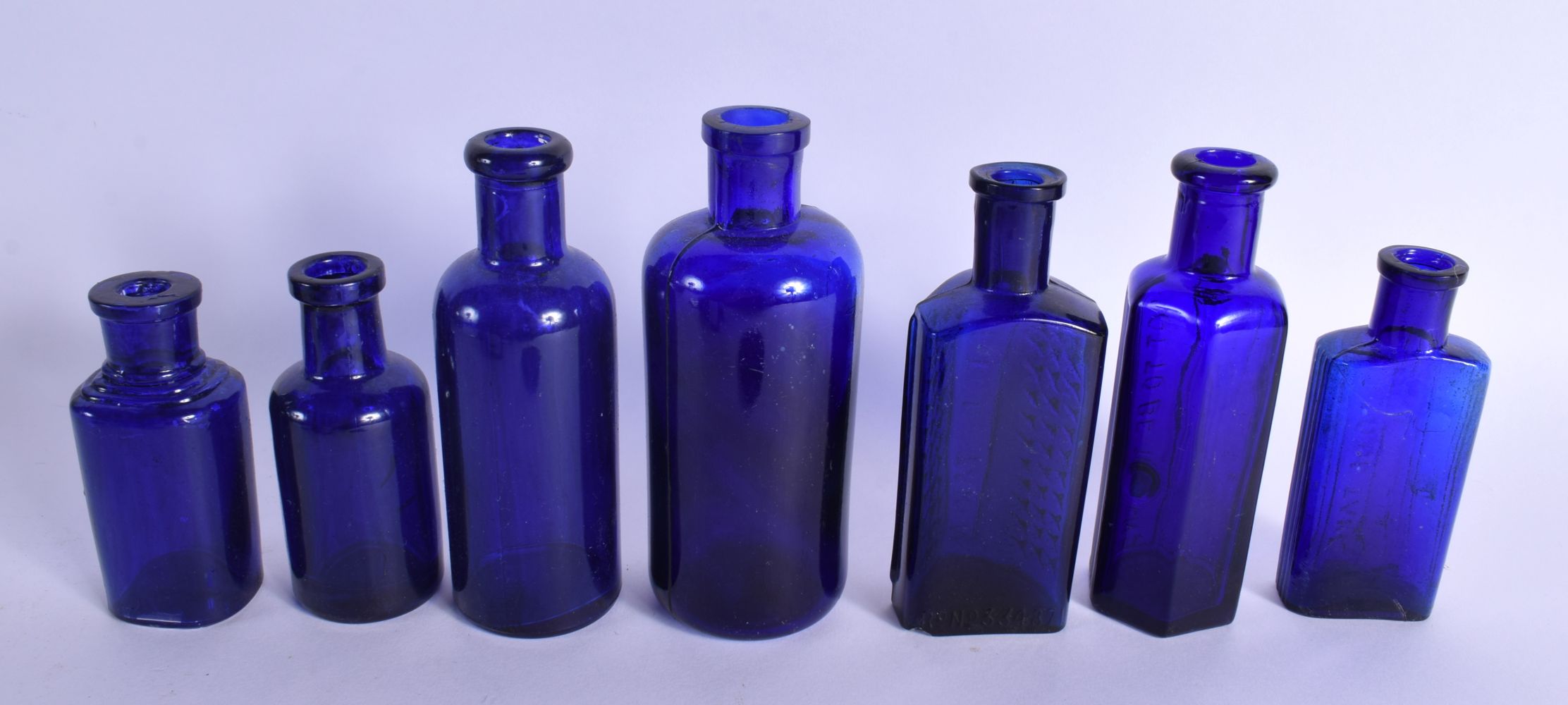 A COLLECTION OF VINTAGE GLASS POISON BOTTLES in various forms and sizes. (qty) - Image 9 of 11