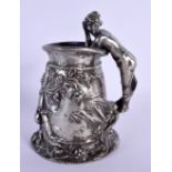 FRENCH ART NOVEAU PEWTER TANKARD HEAVILY EMBOSSED WITH A PUTTI AND A NUDE FIGURE AS A HANDLE. 13.