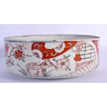 A LARGE 18TH CENTURY JAPANESE EDO PERIOD PORCELAIN BOWL pained with flowers and buildings. 24 cm dia