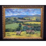 A framed wool needle point picture of sheep in a field 37 x 46 cm.