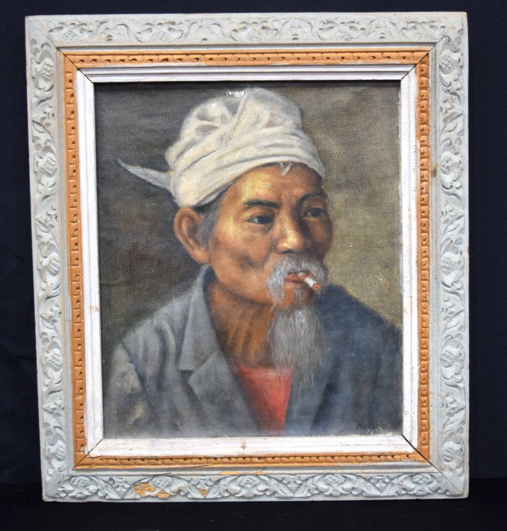 A framed oil on canvas of a South East Asian male indistinctly signed 35 x 29cm