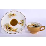 A ROYAL WORCESTER PORCELAIN CUP AND SAUCER by Hart. (2)