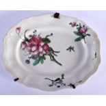 AN 18TH CENTURY FRANCE STRASBOURG FAIENCE TIN GLAZED DISH painted with flowers. 24 cm x 20 cm.