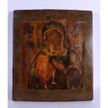 AN ANTIQUE PAINTED RUSSIAN WOOD ICON. 36 cm x 32 cm.