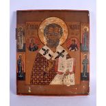 AN ANTIQUE PAINTED RUSSIAN WOOD ICON. 36 cm x 30 cm.