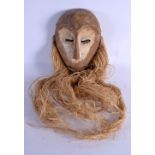 A TRIBAL LEGA MASK with hemp beard. Mask 30 cm x 14 cm. Provenance: Ex Neatham Mill Collection.