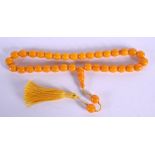 AN ISLAMIC MIDDLE EASTERN AMBER TYPE PRAYER BEAD NECKLACE. 70 grams. 56 cm long.