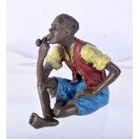 A COLD PAINTED BRONZE OF A SEATED MALE SMOKING A PIPE. 5.6cm x 4.1cm x 6cm, weight 189.2g