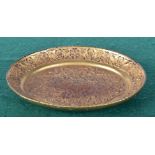 A Chinese gilt metal dish embossed with foliage. 15 x 12cm.