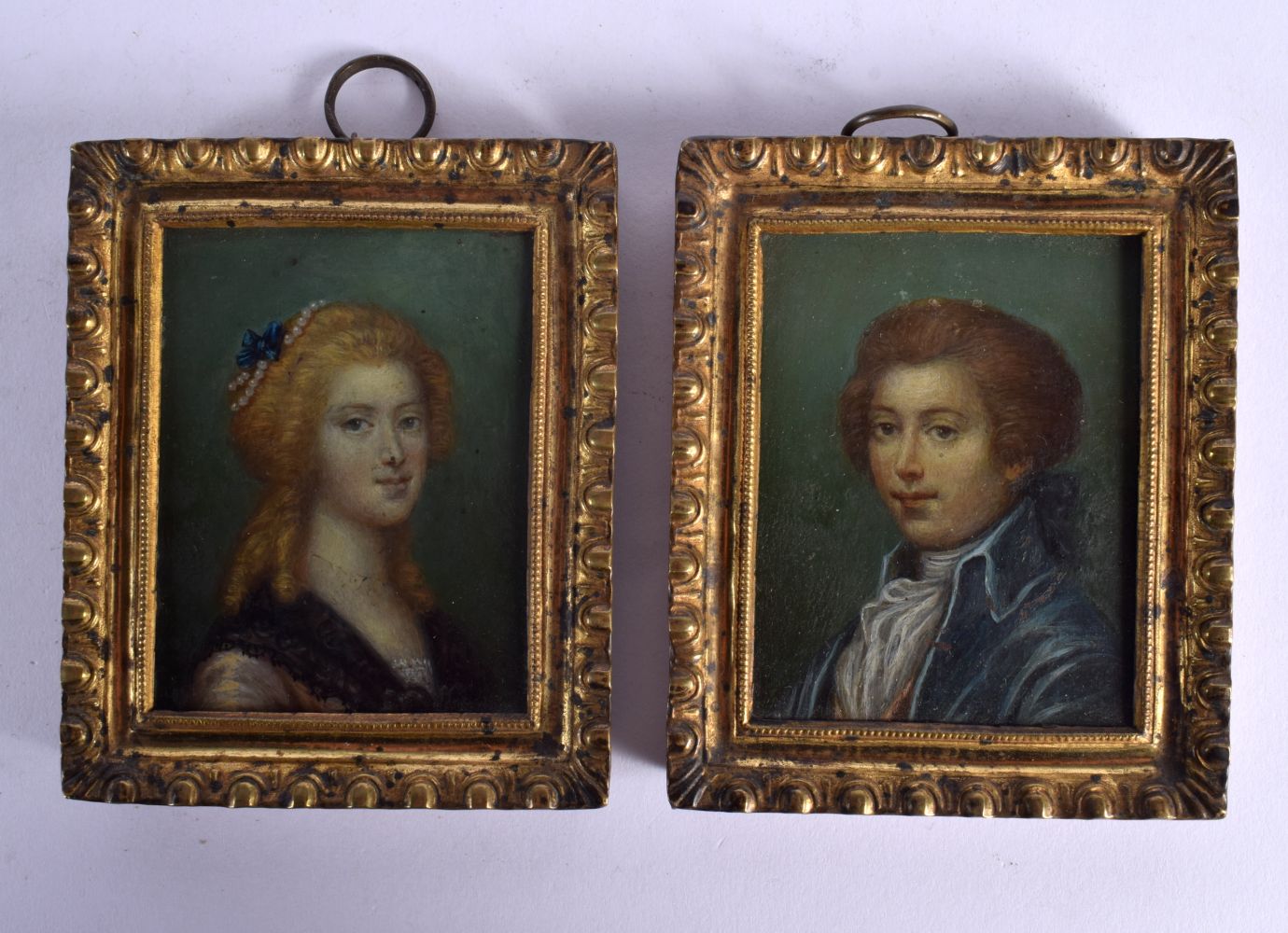 TWO OIL ON BOARD PORTRAIT MINIATURES IN BRASS FRAMES. 7.8cm x 9.3cm (2)