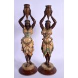 A LARGE PAIR OF ART DECO EUROPEAN COLD PAINTED SPELTER FIGURES modelled as Eastern water carriers. 3