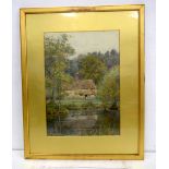 Framed watercolour of a cottage by a pond indistinctly signed 37 x 27 cm.