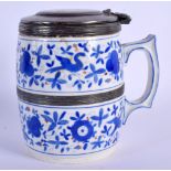 A RARE 18TH/19TH CENTURY GERMAN BLUE AND WHITE PORCELAIN MUG with white metal mounts. 11 cm x 9 cm.