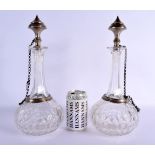 A LARGE PAIR OF ANTIQUE CONTINENTAL TURKISH MARKET GLASS DECANTERS AND STOPPERS. 34 cm high.
