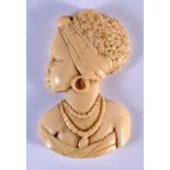 AN EARLY 20TH CENTURY WEST AFRICAN CARVED IVORY PLAQUE OF A FEMALE modelled wearing a necklace. 9 cm